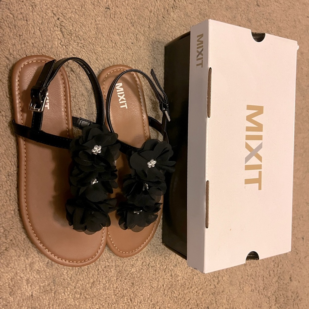 Black and tan sandals with flowers